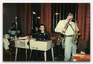 Ken Sawyer on two saxophones